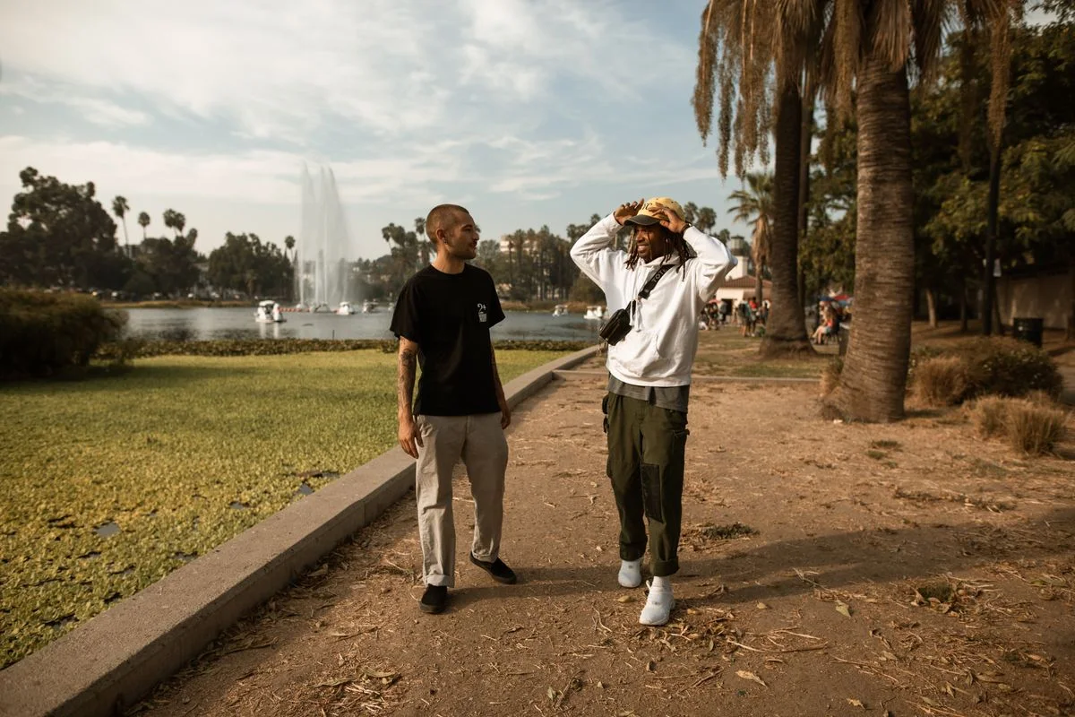 Two adults talking together outdoors