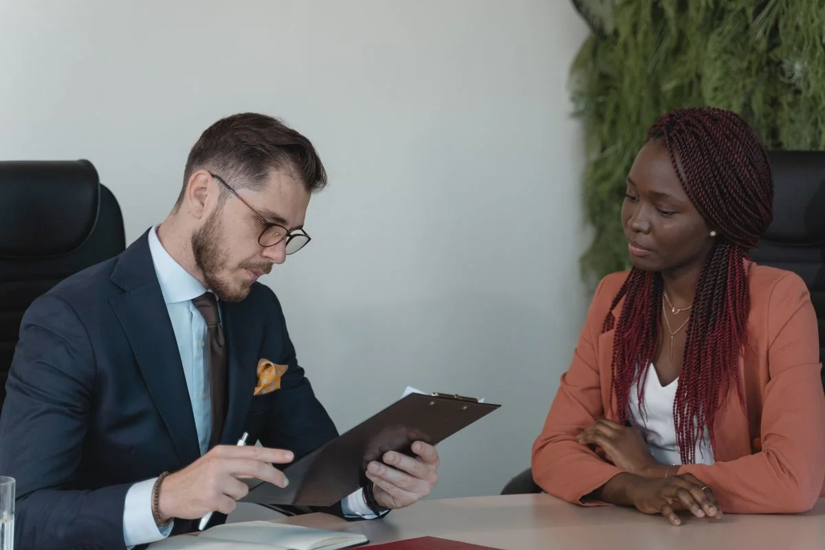 Two adults reviewing a resume together