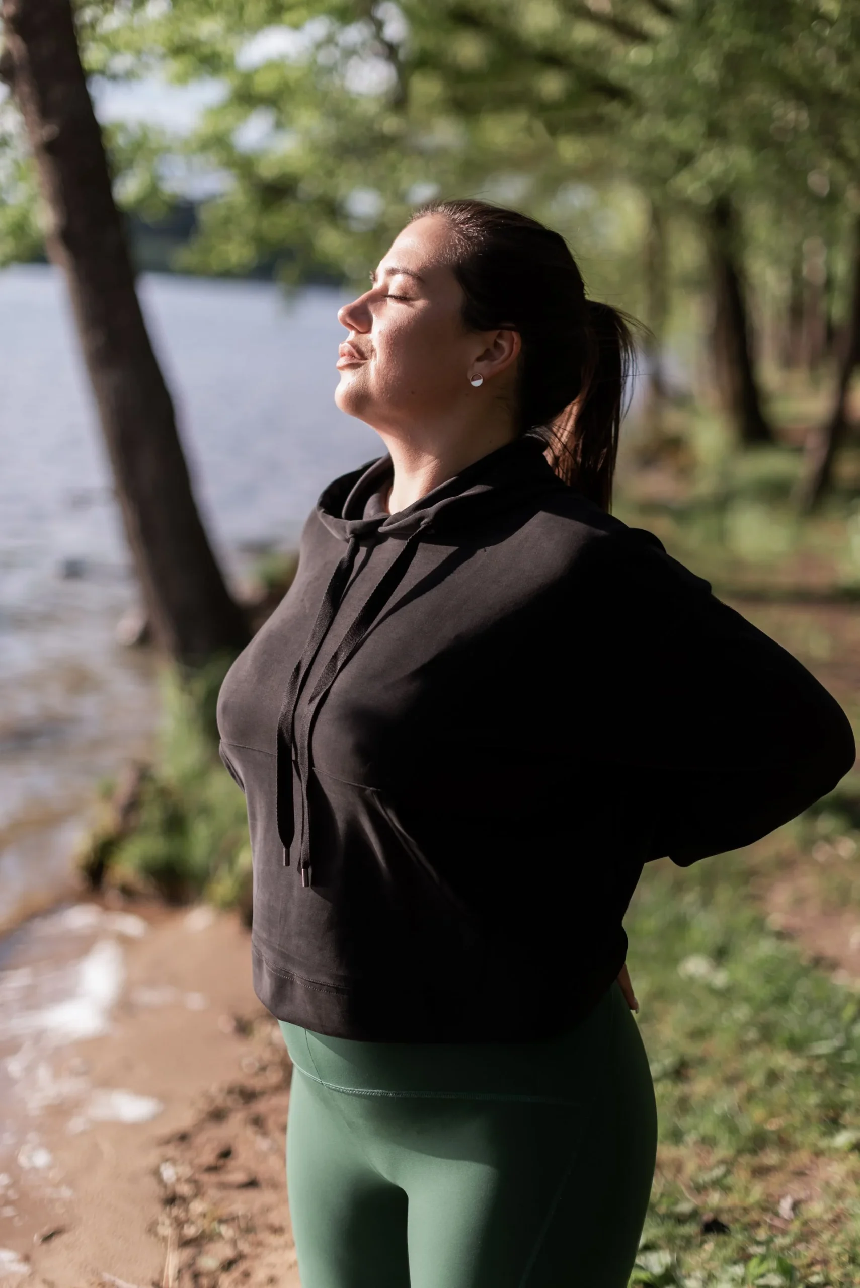 An adult taking a calm breath outdoors