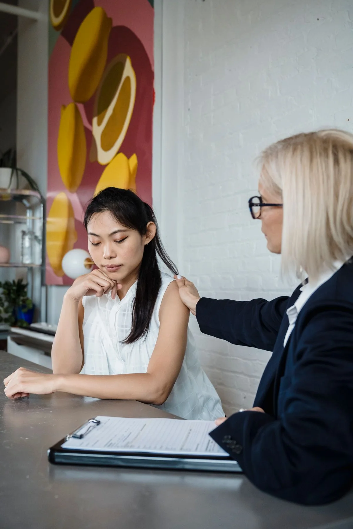 Two adults in an attentive one to one conversation
