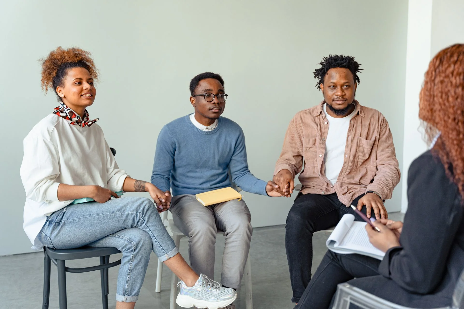 Adults listening and sharing in a supportive discussion circle