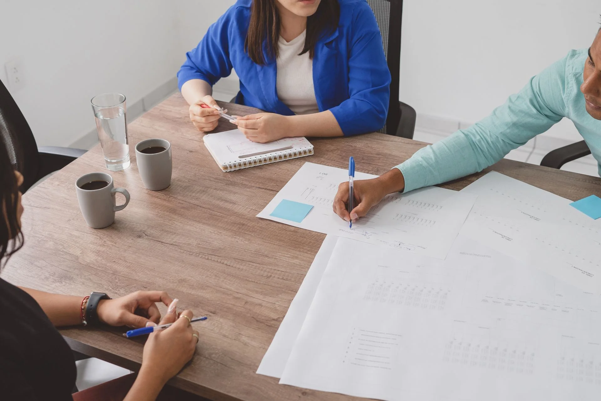 Adults reviewing a plan together around a table