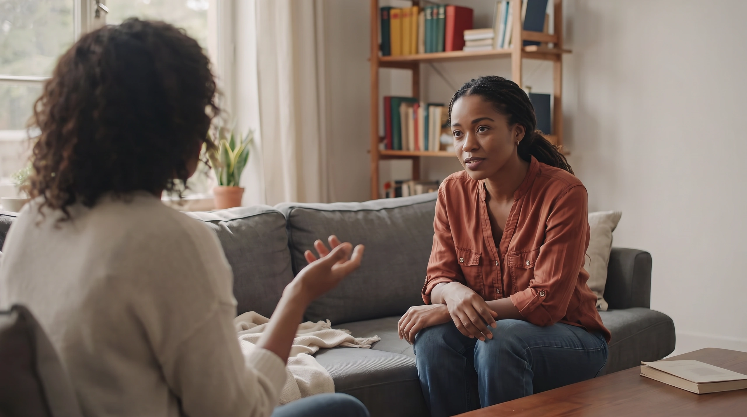 A therapist and patient talking in a welcoming room