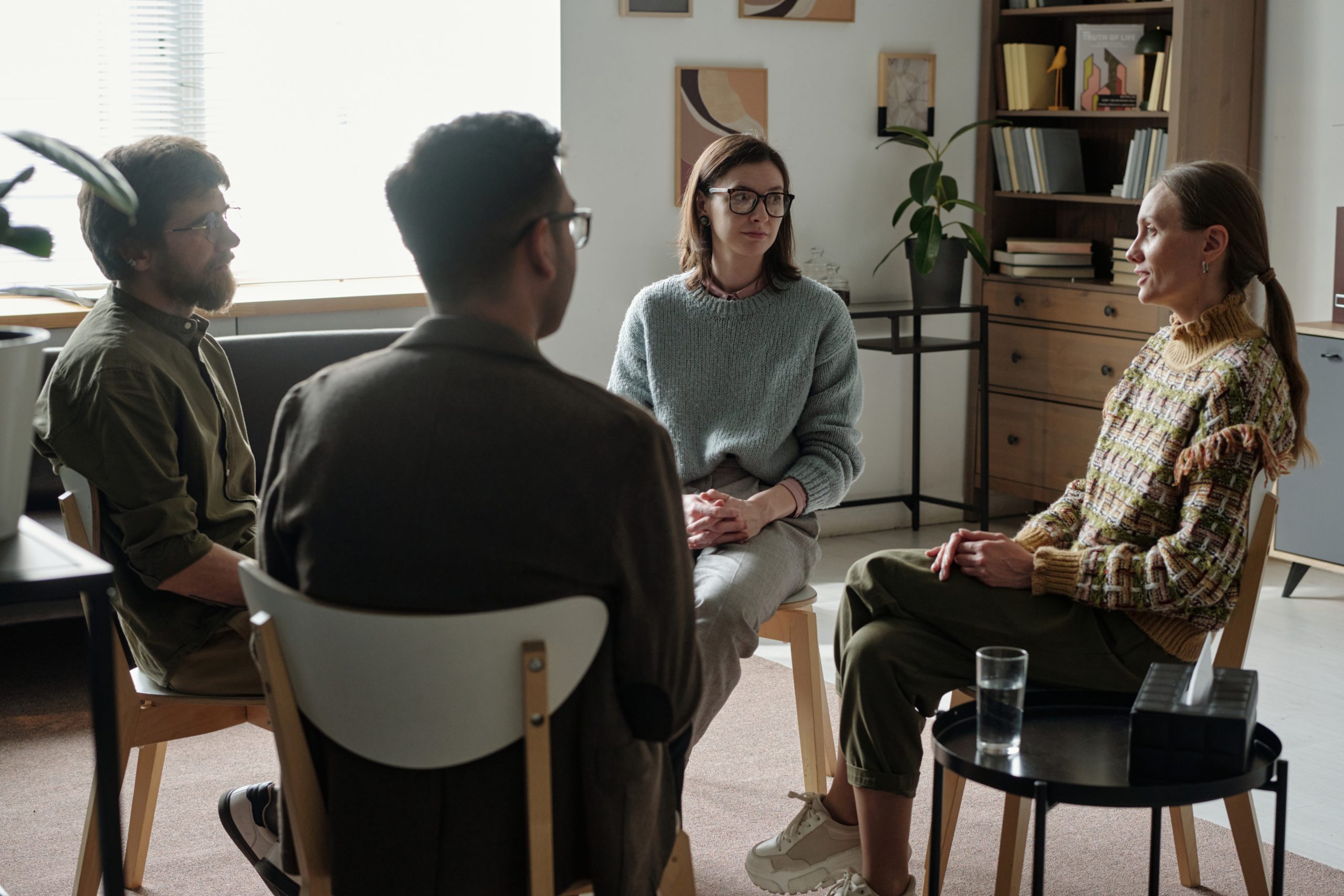Adults participating in a group therapy session